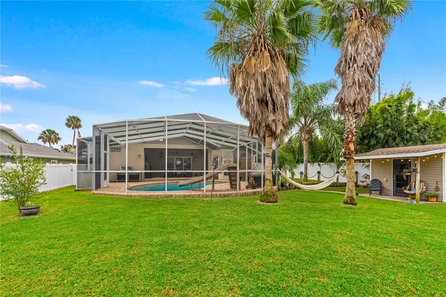 a kitchen with a refrigerator and table