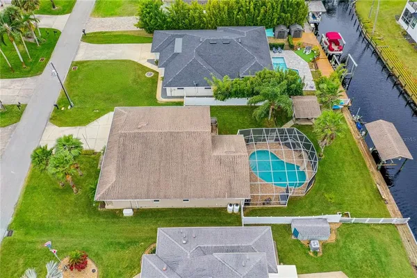 a view of a swimming pool with a table and chairs