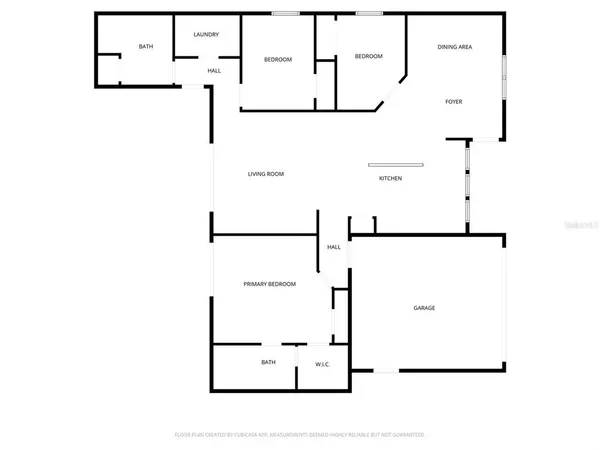 a view of a brick house with a chairs and table in a patio