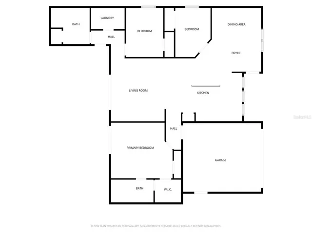 a view of a brick house with a chairs and table in a patio