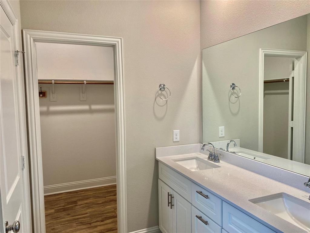 2258 Templin Avenue Forney, TX 75126 - Photo 11 of 15 a bathroom with a granite countertop sink and a mirror