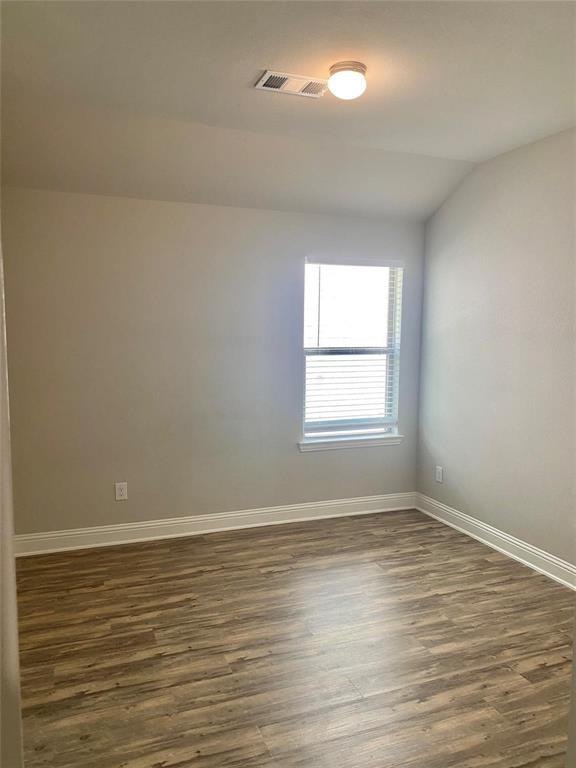 2258 Templin Avenue Forney, TX 75126 - Photo 7 of 15 wooden floor in an empty room with a window