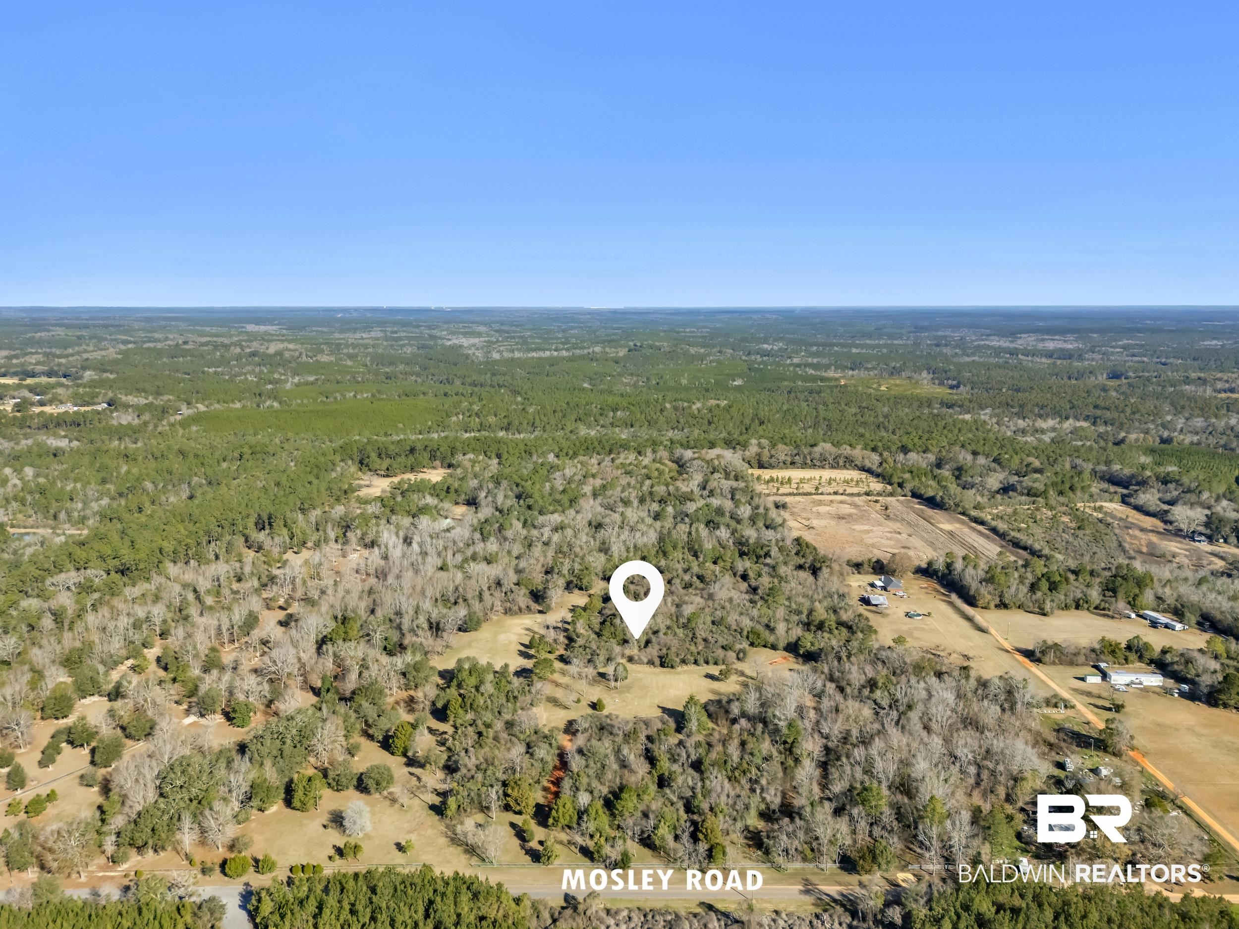 16691 Mosley Road Stapleton, AL 36578 - Photo 26 of 32 Aerial view of a heavily wooded area