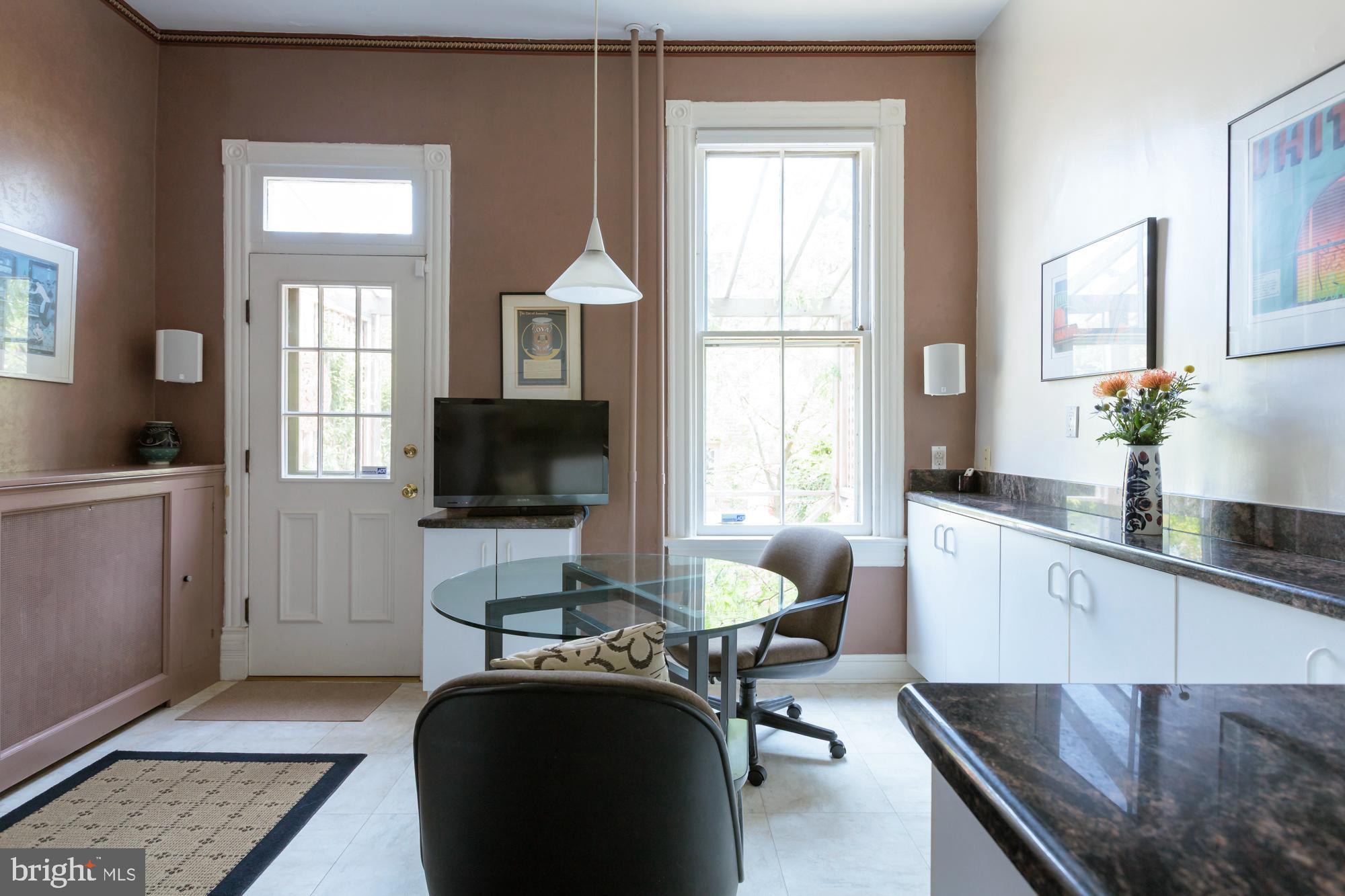 244 8th Street Southeast Washington, DC 20003 - Photo 16 of 53 a living room with furniture and a flat screen tv