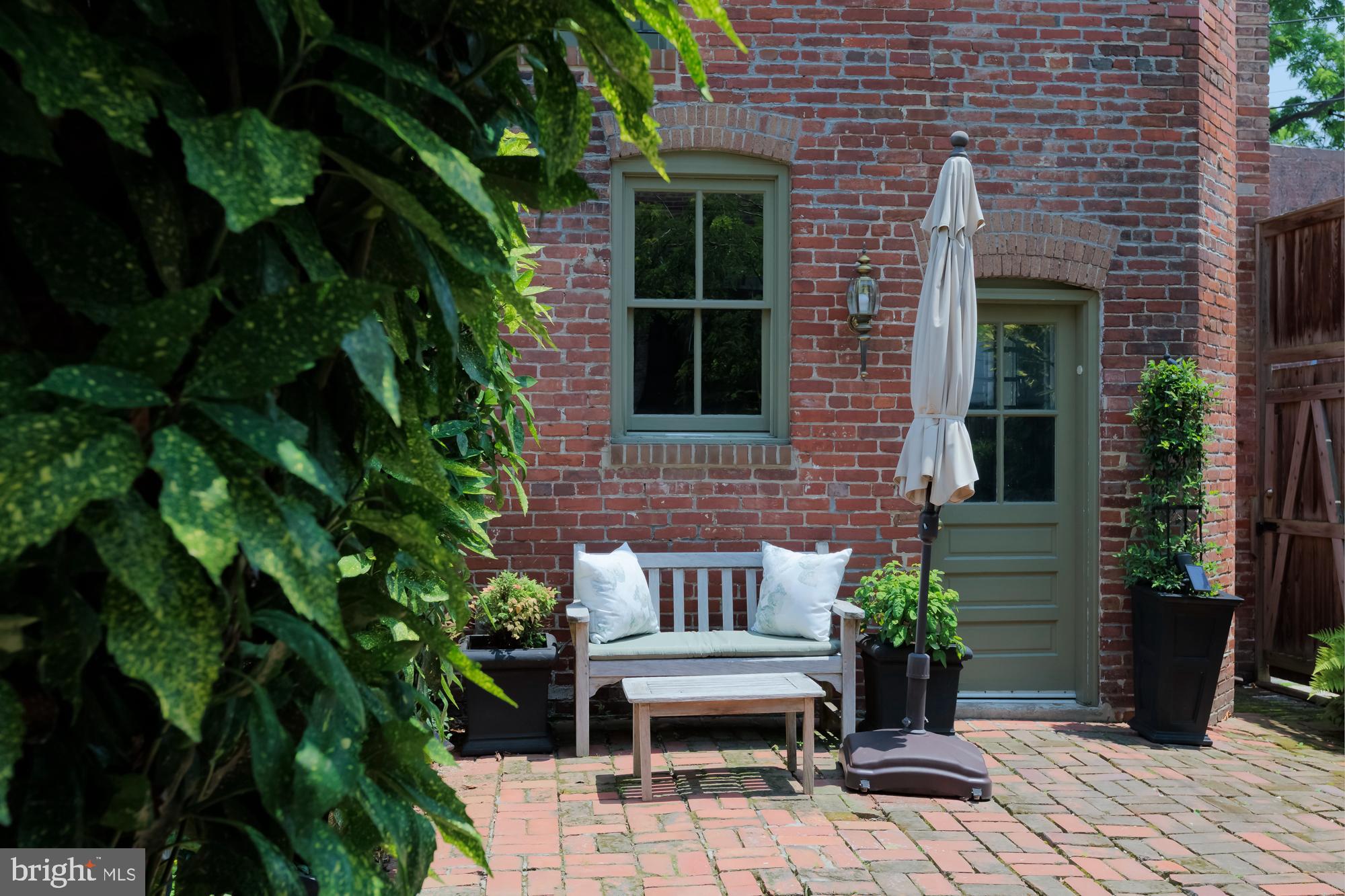 244 8th Street Southeast Washington, DC 20003 - Photo 22 of 53 a wooden bench sitting in front of a building