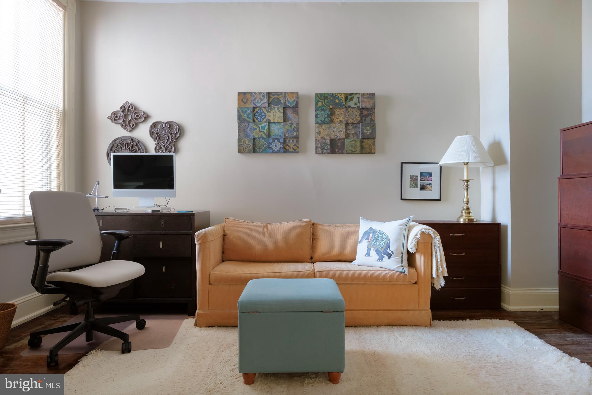 244 8th Street Southeast Washington, DC 20003 - Photo 33 of 53 a living room with furniture a couch and a flat screen tv