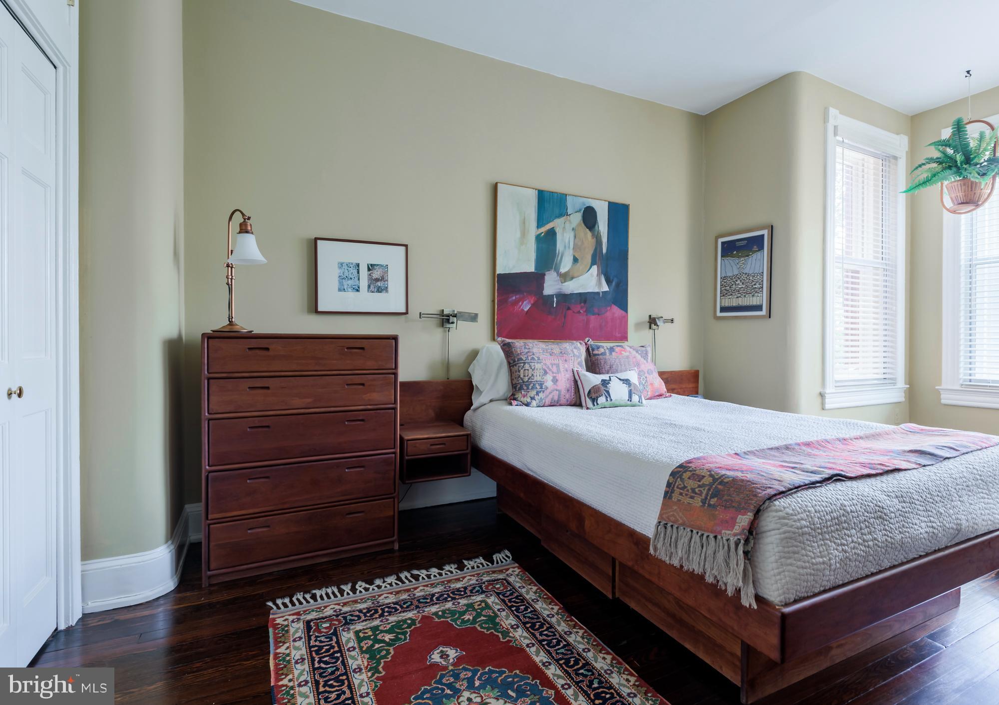 244 8th Street Southeast Washington, DC 20003 - Photo 36 of 53 a bedroom with a bed and wooden floor