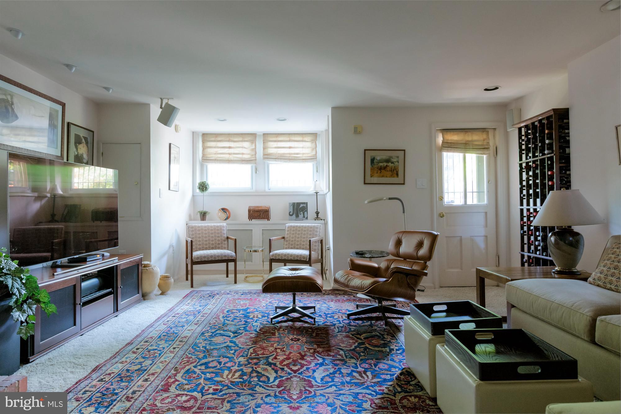 244 8th Street Southeast Washington, DC 20003 - Photo 42 of 53 a living room with furniture and a flat screen tv