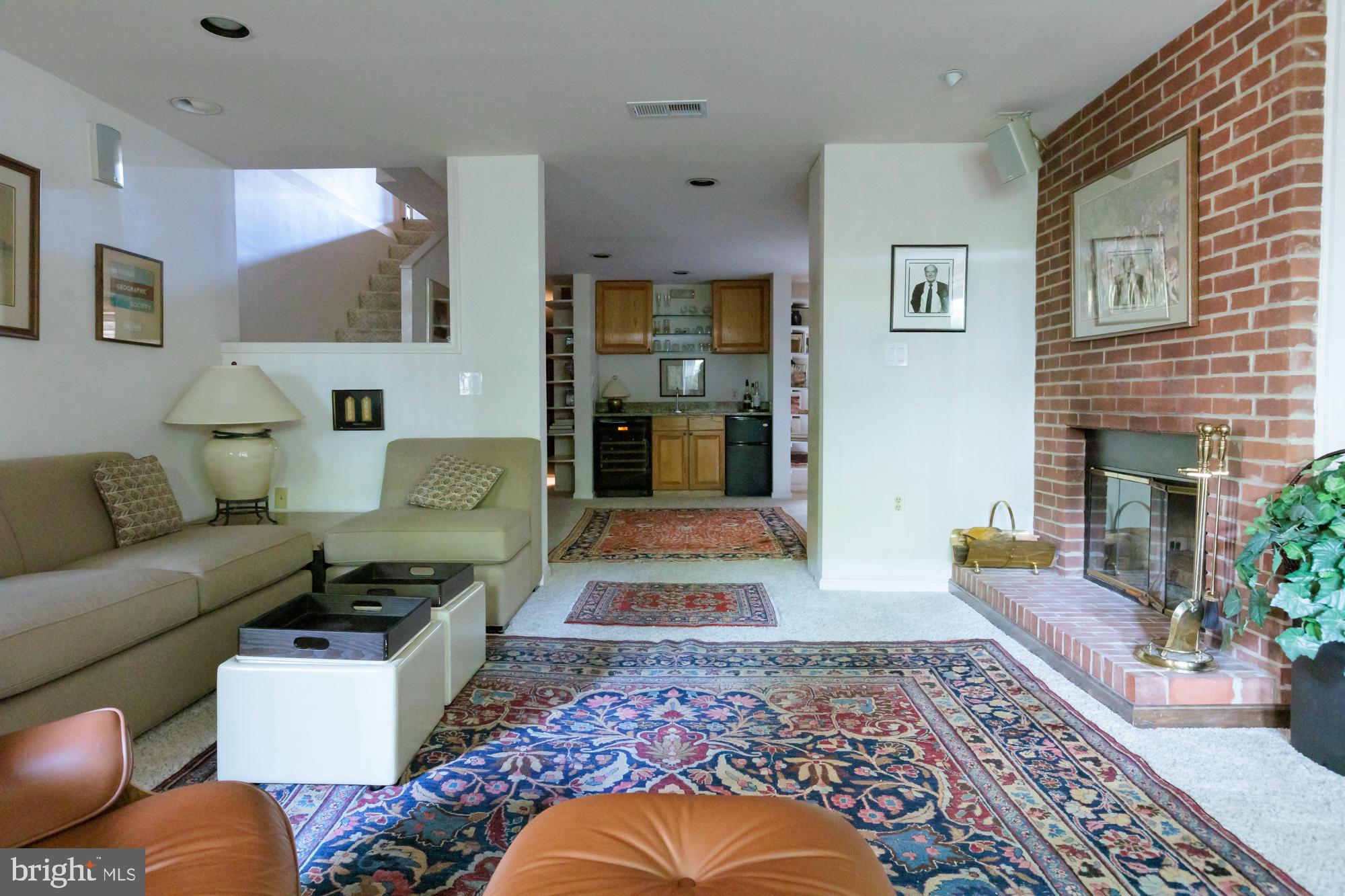 244 8th Street Southeast Washington, DC 20003 - Photo 44 of 53 a living room with furniture and a fireplace