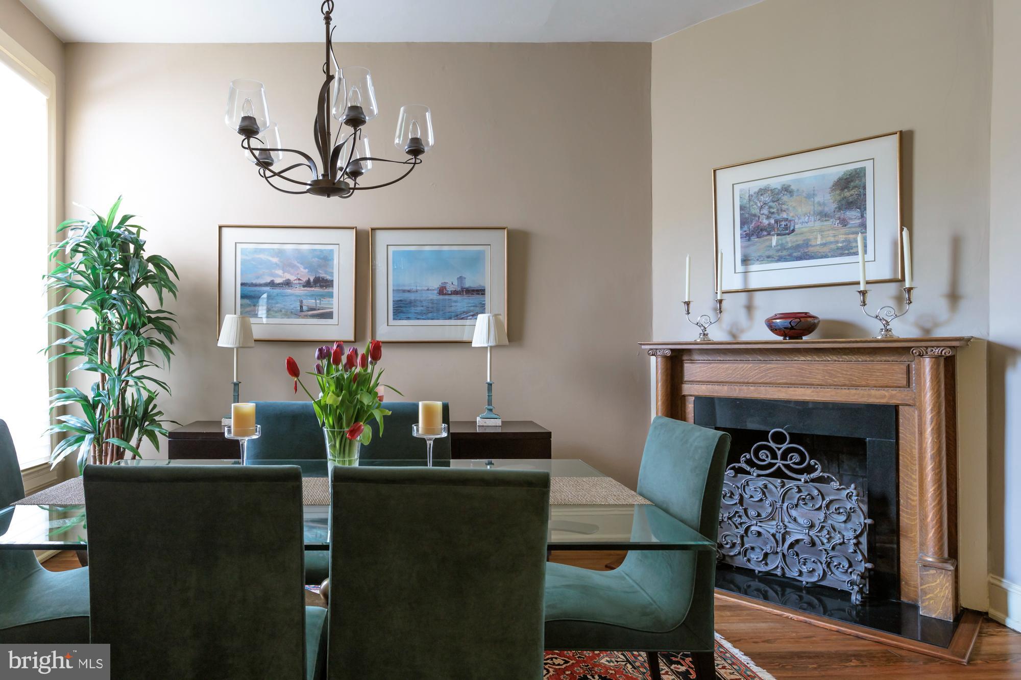 244 8th Street Southeast Washington, DC 20003 - Photo 10 of 53 a living room with furniture a chandelier and a fireplace