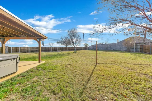 a view of a back yard with an outdoor space