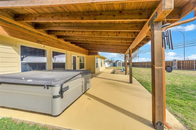 a swimming pool with large glass windows and painted walls