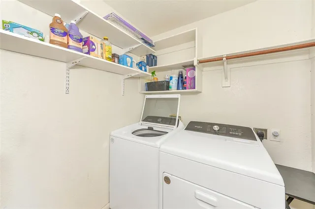 a utility room with dryer and washer