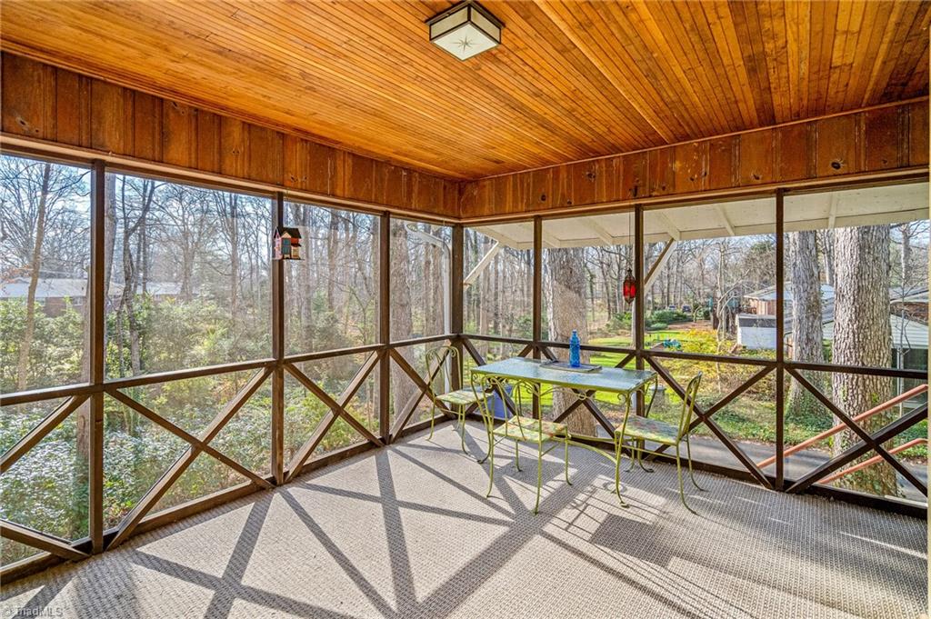 1263 Huntingdon Road Winston-Salem, NC 27104 - Photo 19 of 26 Screened porch overlooks backyard with lovely large azaleas