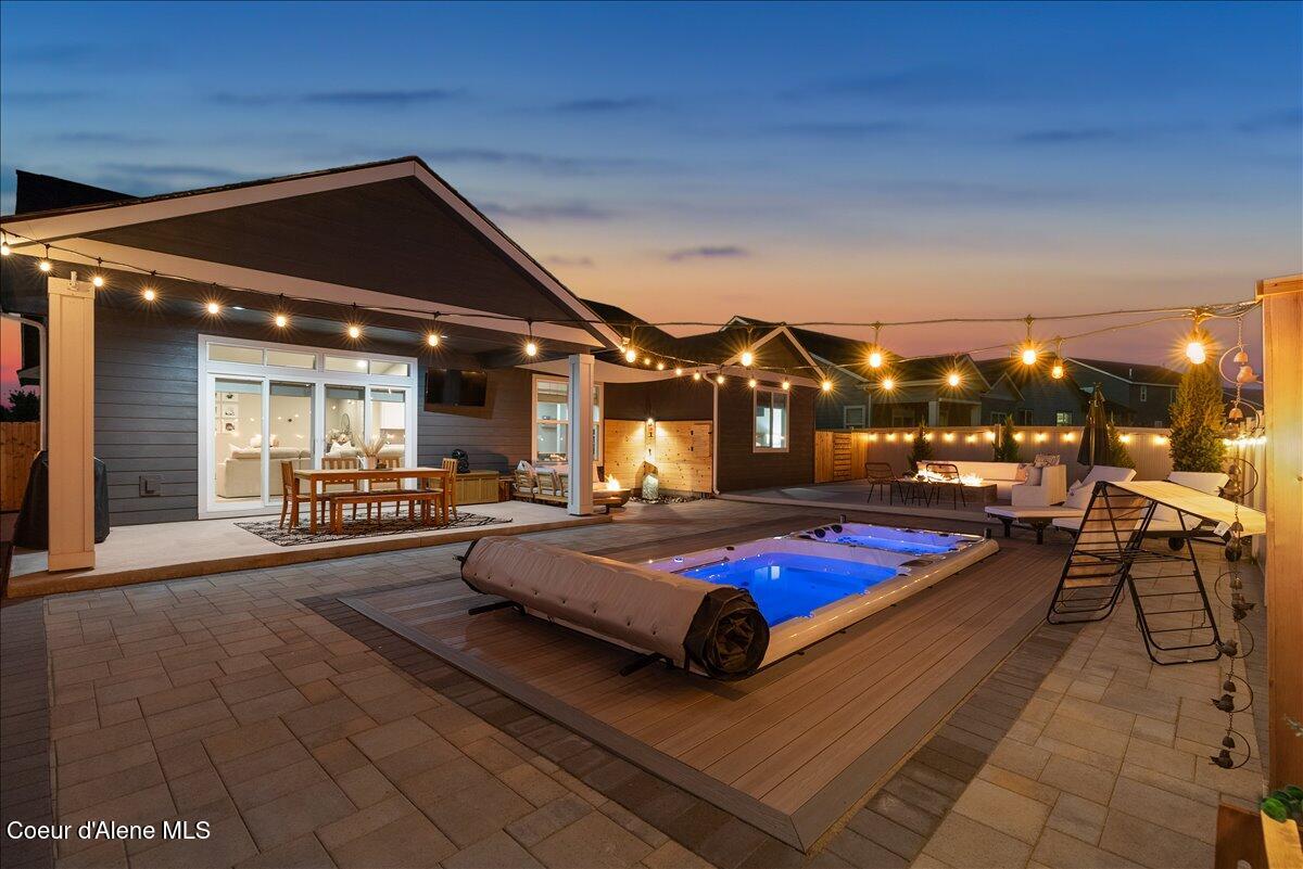 4332 West Enclave Way Coeur D'Alene, ID 83815 - Photo 15 of 52 8-Back of home and pool twlight