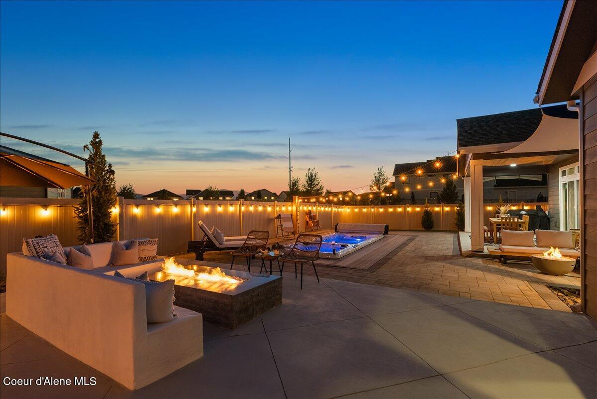 4332 West Enclave Way Coeur D'Alene, ID 83815 - Photo 17 of 52 4-Backyard and pool twilight