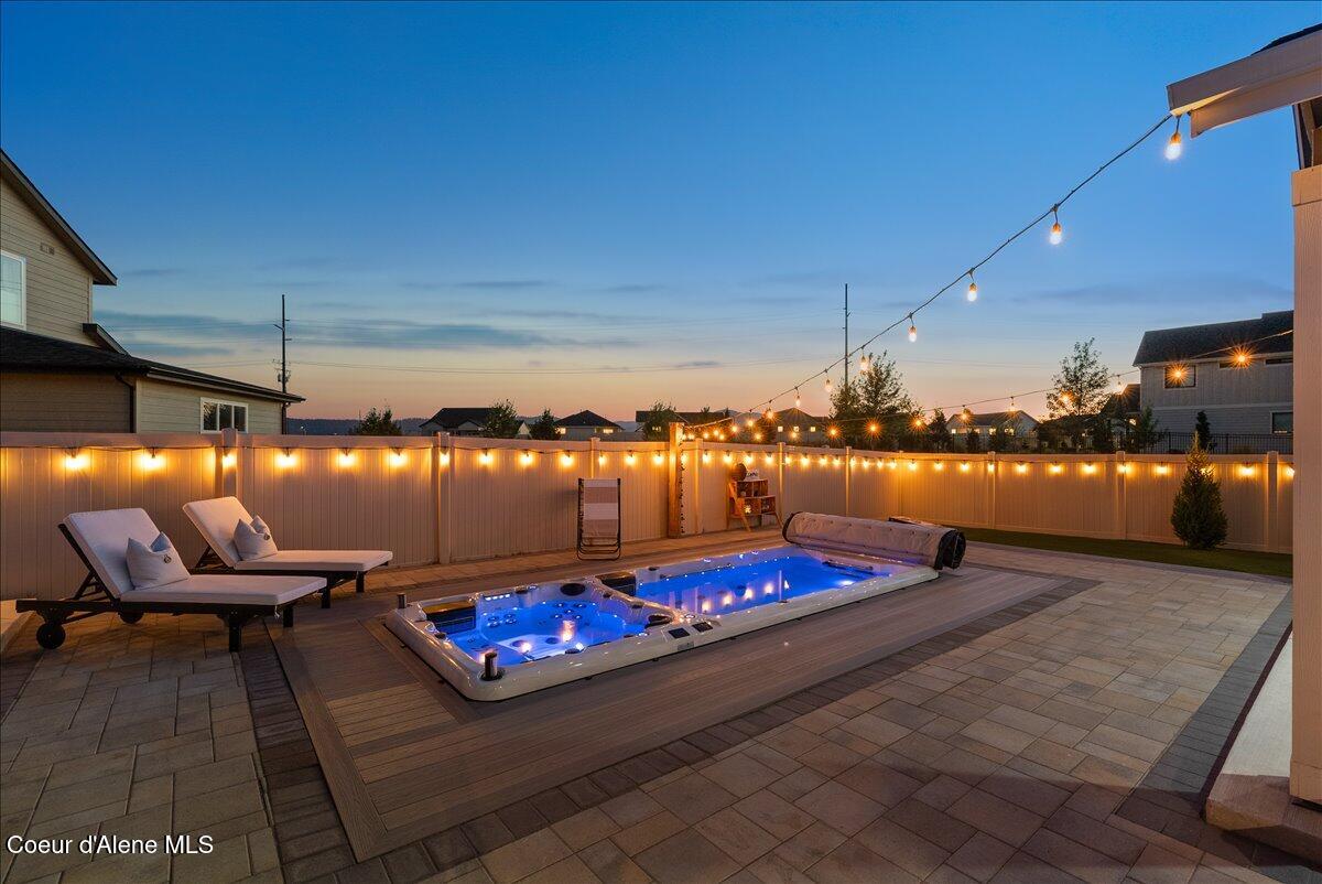 4332 West Enclave Way Coeur D'Alene, ID 83815 - Photo 20 of 52 1-Backyard and pool twilight