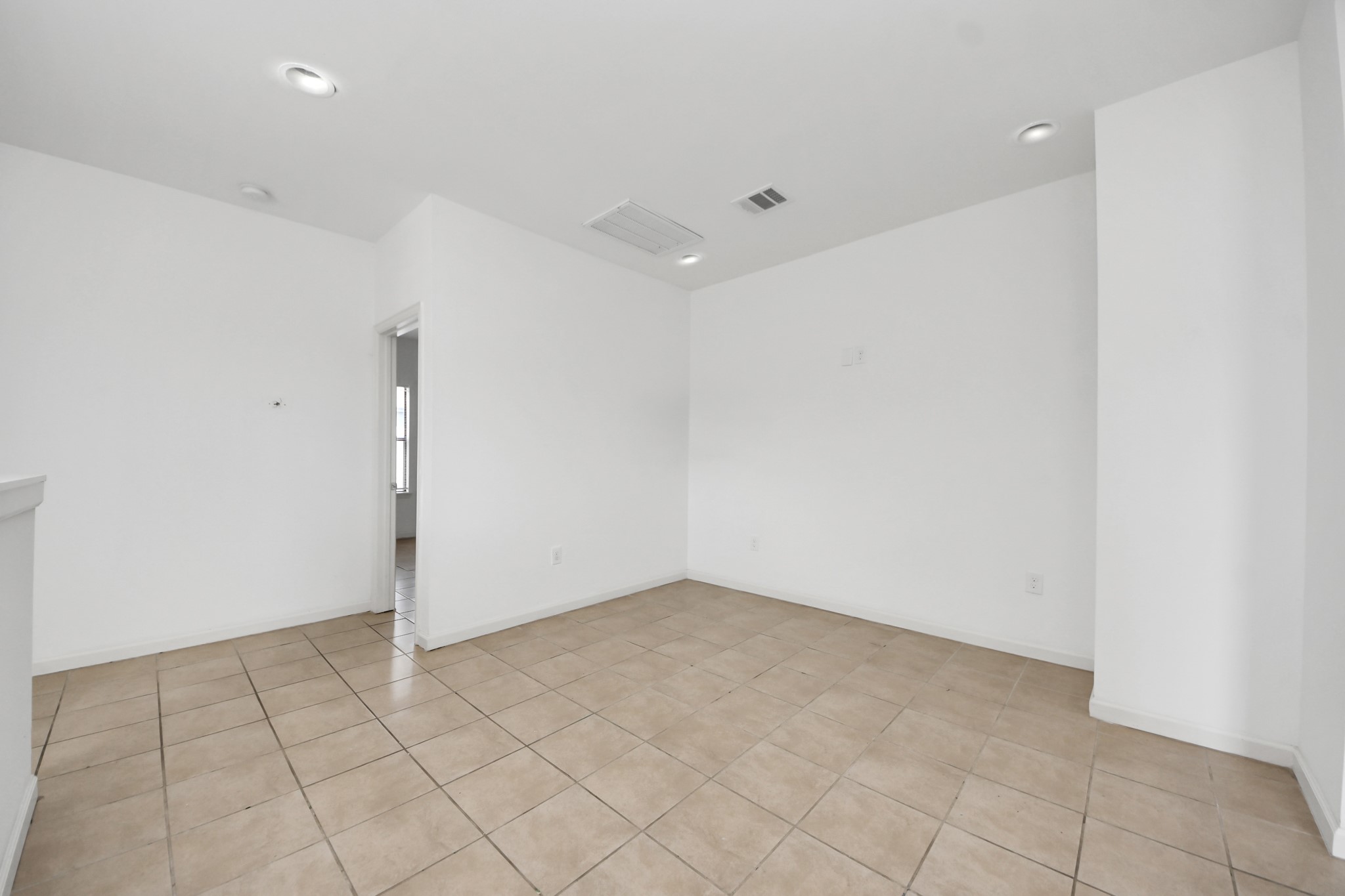 4327 Oak Ridge Drive, Unit A Pasadena, TX 77503 - Photo 10 of 20 an empty room with white walls and tiles