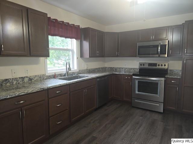 303 North Washington Street Carthage, IL 62321 - Photo 2 of 25 a kitchen with granite countertop a sink stainless steel appliances and window