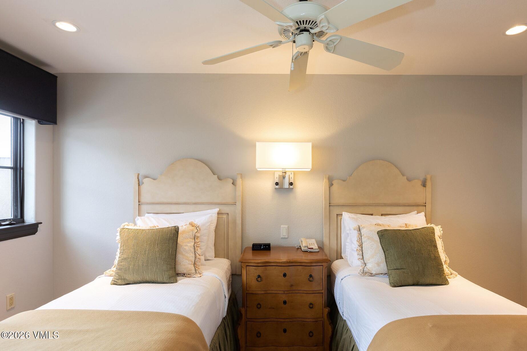 210 Offerson Road, Unit R206 WK 4 SUMMER FLOAT WK Beaver Creek, CO 81620 - Photo 18 of 31 a bedroom with a bed and a chandelier