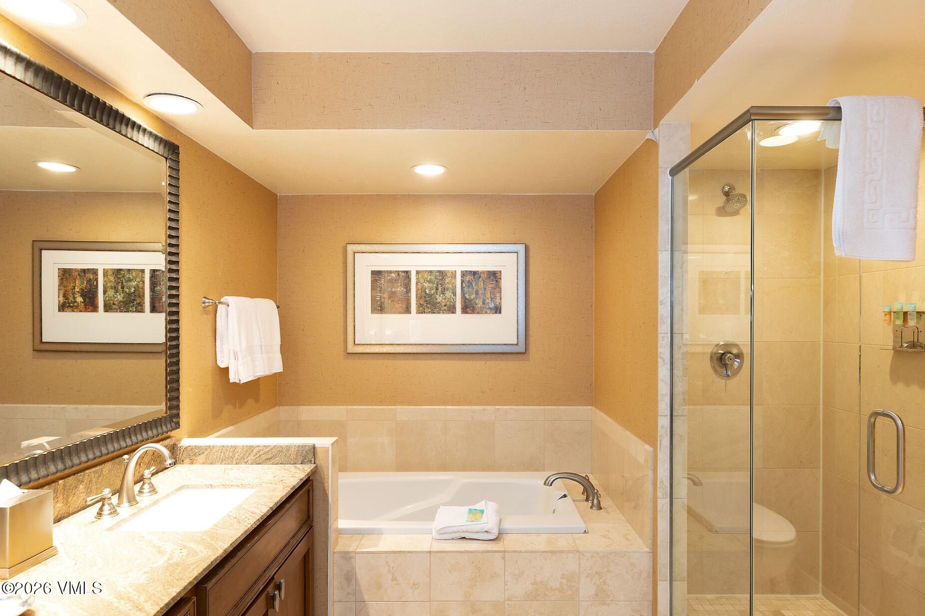 210 Offerson Road, Unit R206 WK 4 SUMMER FLOAT WK Beaver Creek, CO 81620 - Photo 20 of 31 a bathroom with a granite countertop tub sink and mirror