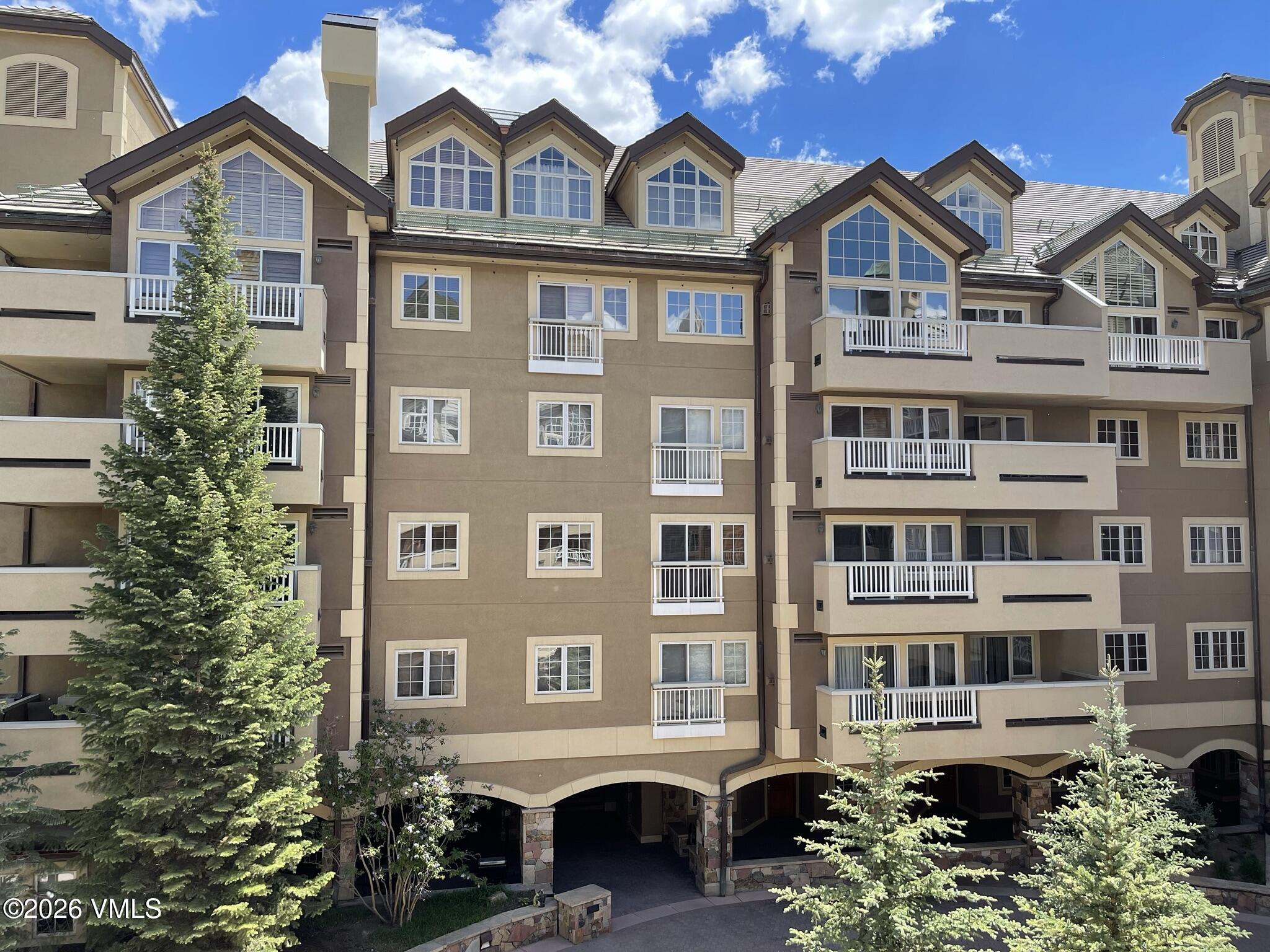 210 Offerson Road, Unit R206 WK 4 SUMMER FLOAT WK Beaver Creek, CO 81620 - Photo 6 of 31 a front view of a residential apartment building with a yard