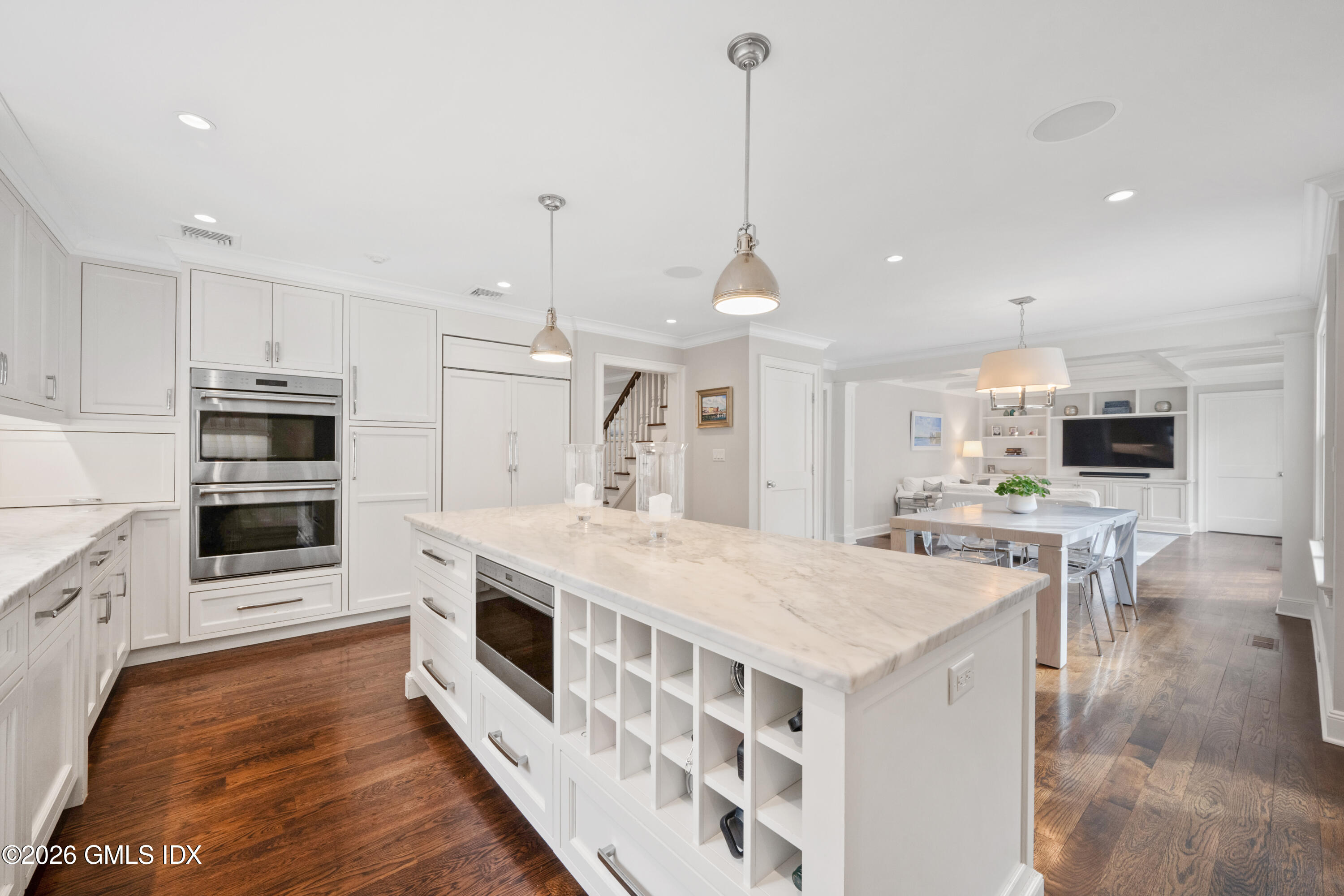 15 Pell Place Riverside, CT 06878 - Photo 6 of 35 a large kitchen with kitchen island a stove a sink a refrigerator a center island and wooden floor