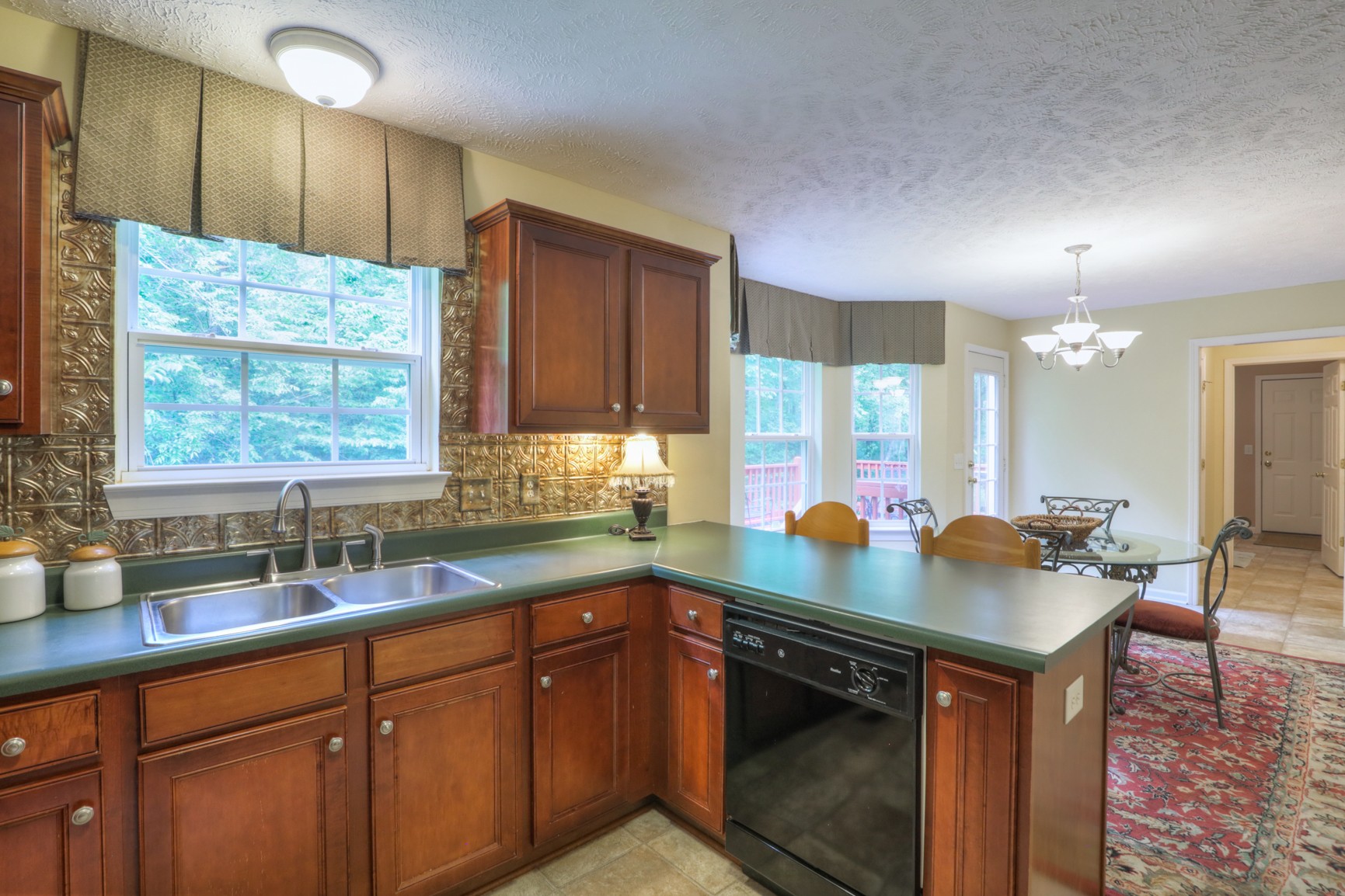 4166 Turnberry Road Lebanon, TN 37090 - Photo 6 of 25 a kitchen with stainless steel appliances granite countertop a sink stove and cabinets