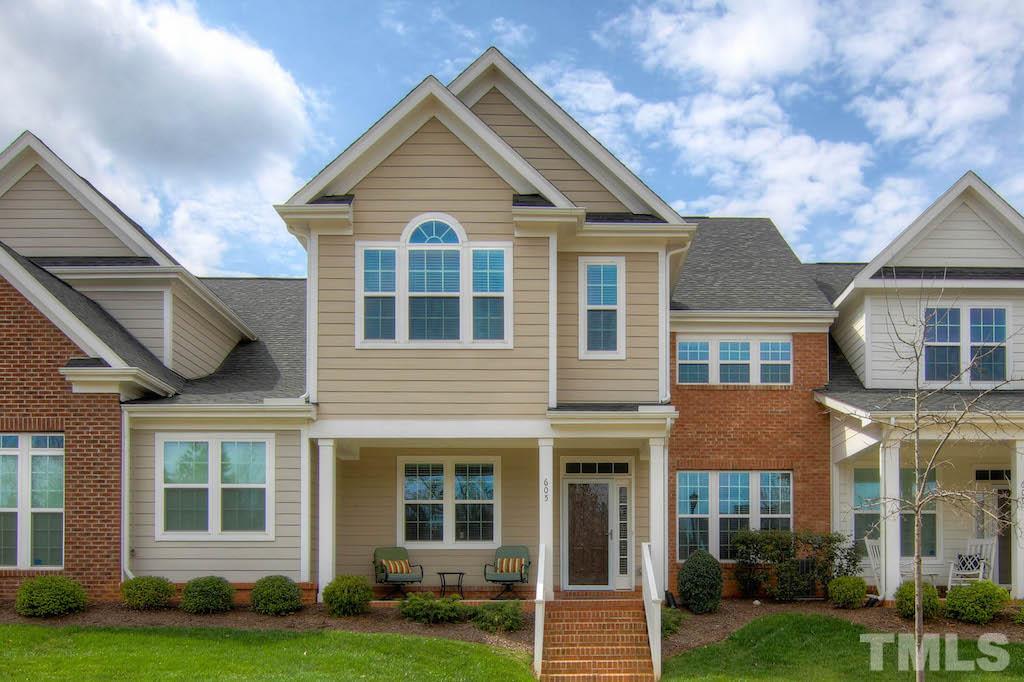 605 Democracy Street Raleigh, NC 27603 - Photo 1 of 25 a front view of a house with a yard