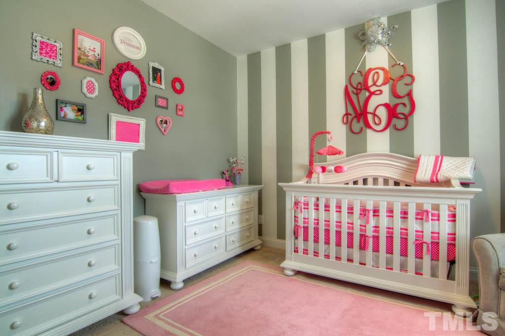 605 Democracy Street Raleigh, NC 27603 - Photo 17 of 25 a bedroom with baby bed toys and dresser