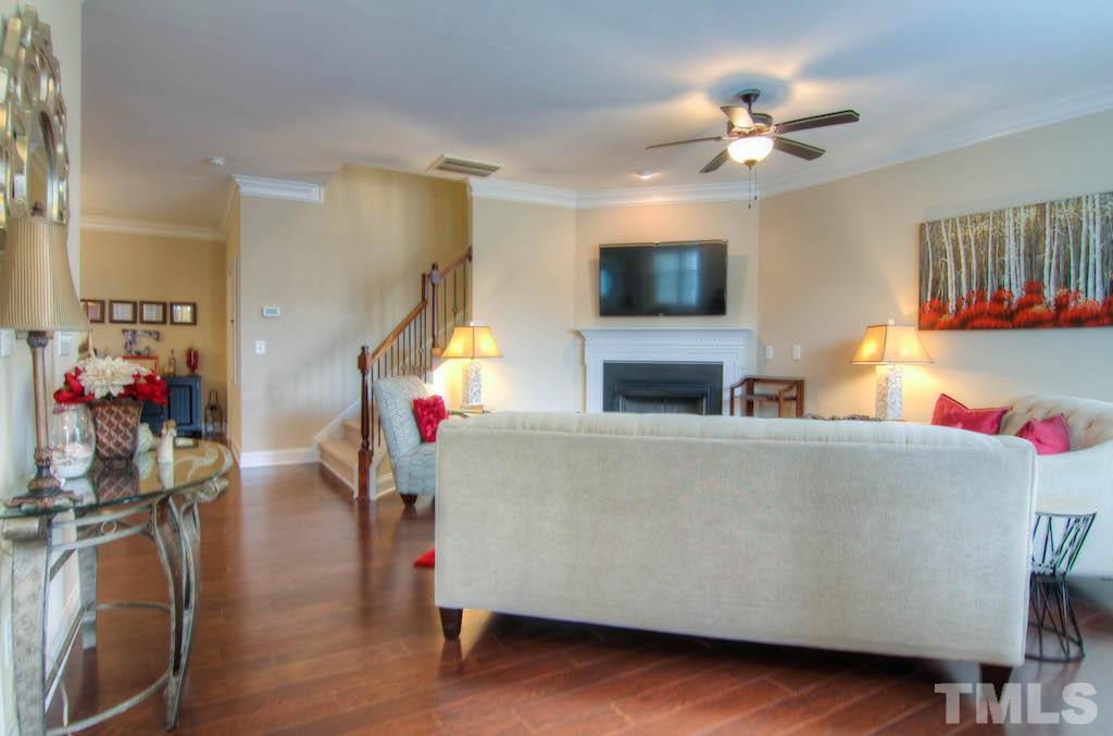 605 Democracy Street Raleigh, NC 27603 - Photo 3 of 25 a living room with furniture and a flat screen tv