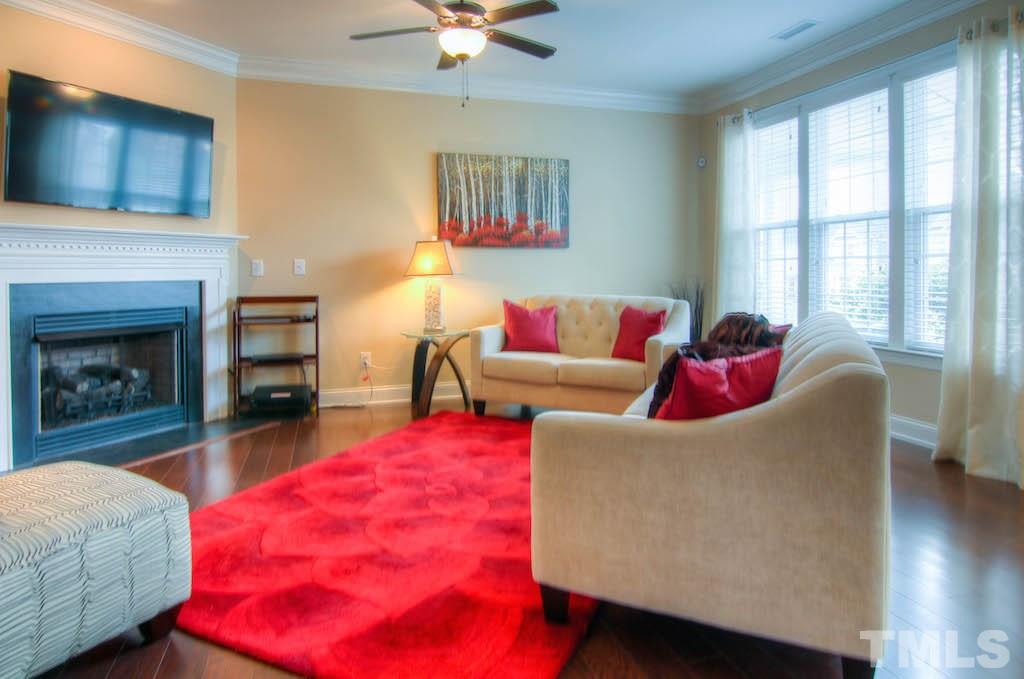 605 Democracy Street Raleigh, NC 27603 - Photo 9 of 25 a living room with furniture and a fireplace