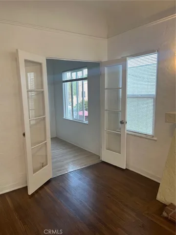 a view of a house with wooden fence