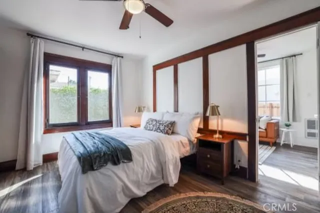 a view of a livingroom with a ceiling fan and window