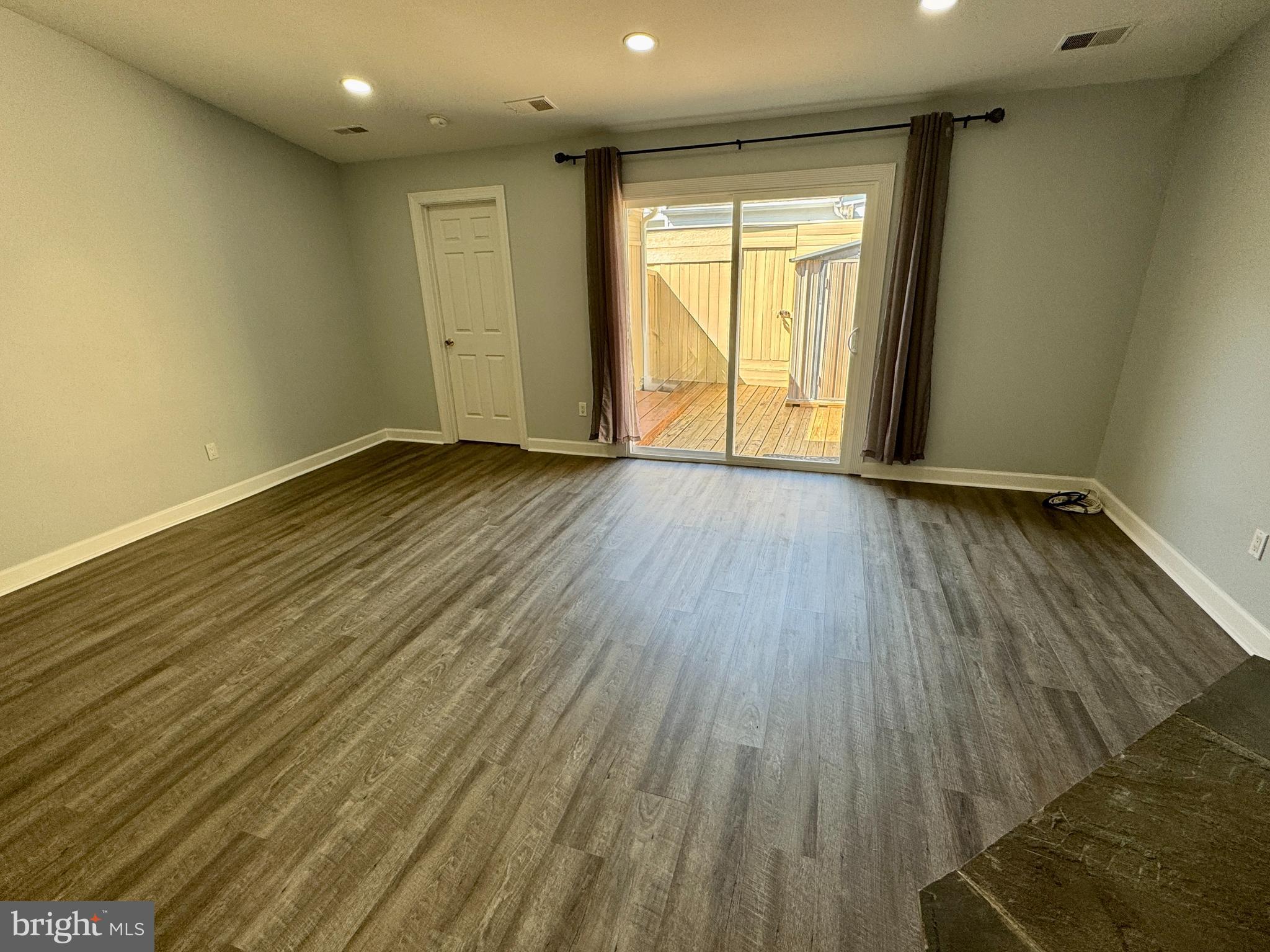 3664 Tavern Way Triangle, VA 22172 - Photo 13 of 28 an empty room with wooden floor and windows