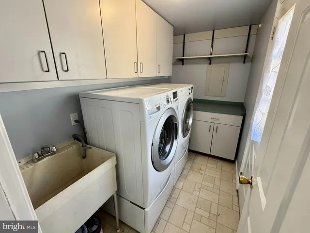 a utility room with dryer and washer