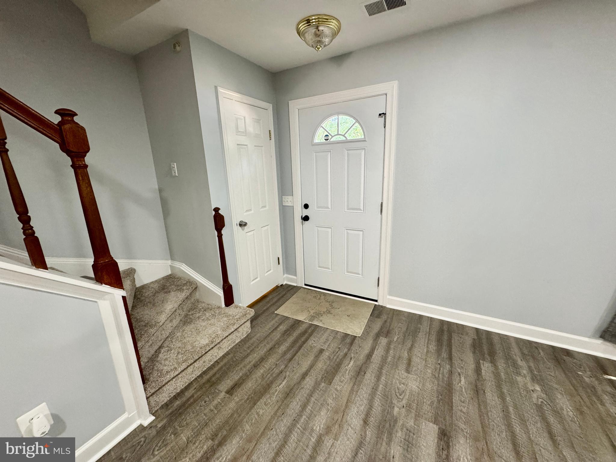 3664 Tavern Way Triangle, VA 22172 - Photo 4 of 28 a view of an empty room with wooden floor and a window