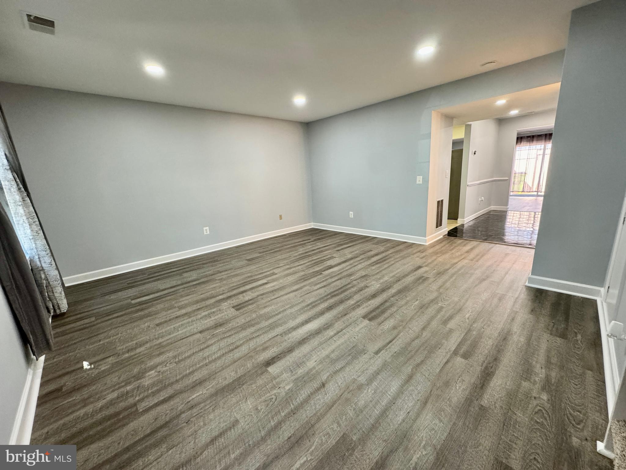 3664 Tavern Way Triangle, VA 22172 - Photo 5 of 28 an empty room with wooden floor and windows