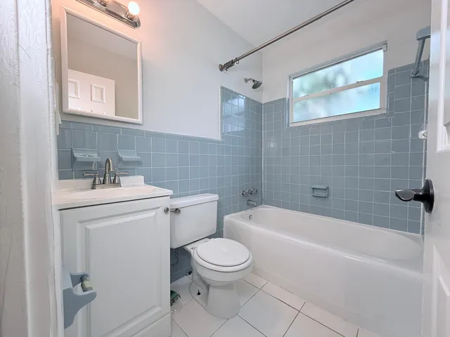 a bathroom with a sink a toilet and a bathtub