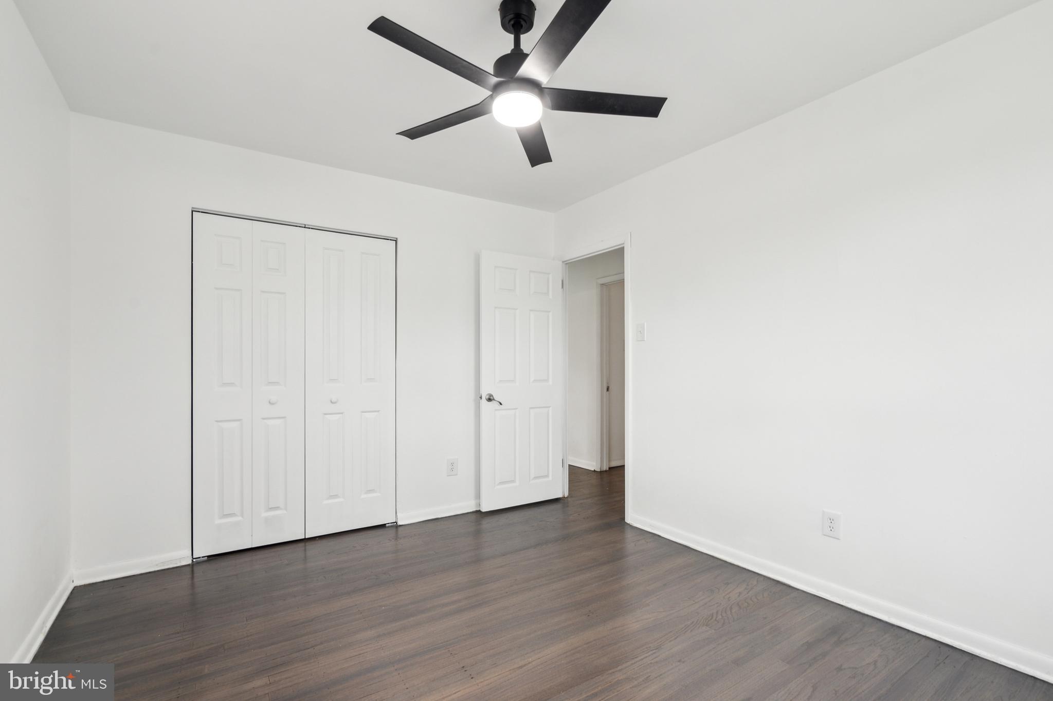 306 Colonial Road Edgewater Park, NJ 08010 - Photo 18 of 25 a view of an empty room with wooden floor