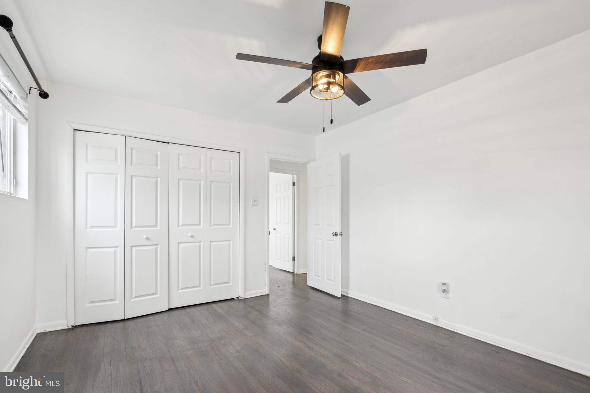 306 Colonial Road Edgewater Park, NJ 08010 - Photo 20 of 25 an empty room with wooden floor closet and windows