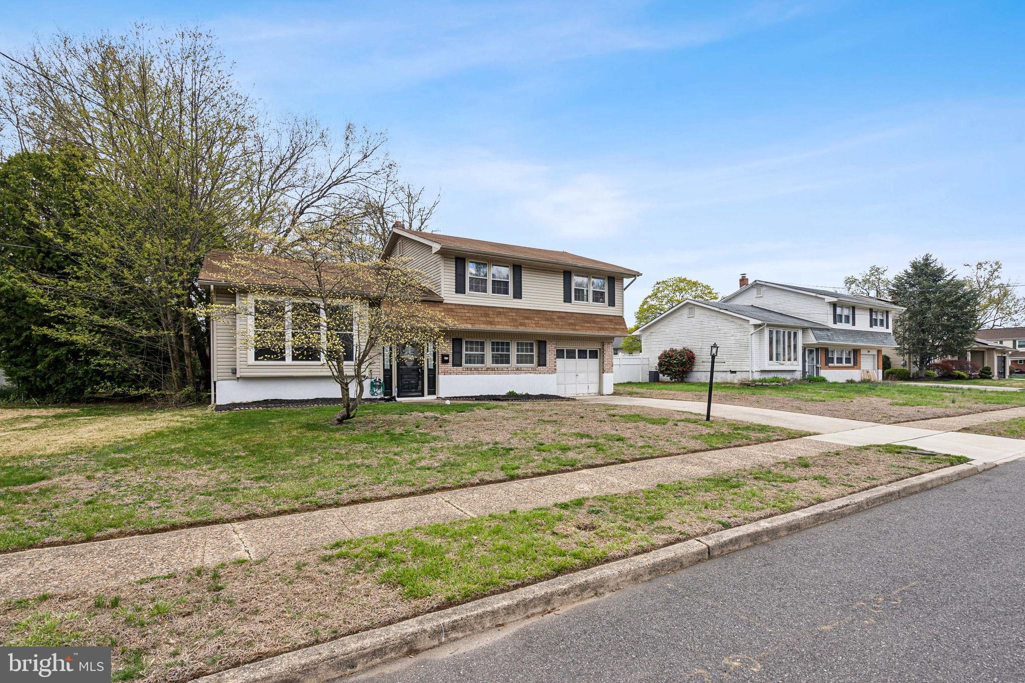 306 Colonial Road Edgewater Park, NJ 08010 - Photo 3 of 25 a view of a house with a yard and large tree