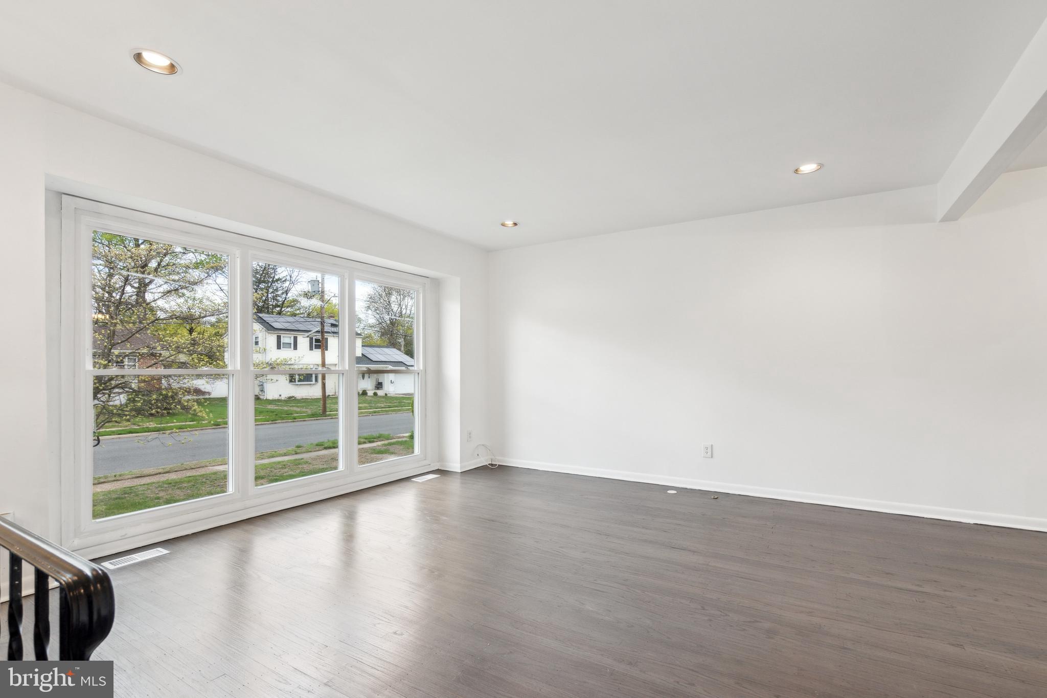 306 Colonial Road Edgewater Park, NJ 08010 - Photo 7 of 25 wooden floor in an empty room with a window