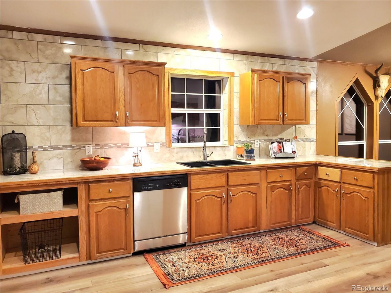 5339 County Road 19 Florence, CO 81226 - Photo 17 of 50 Well appointed kitchen with marble tile look countertops and backsplash all the way to the ceiling
