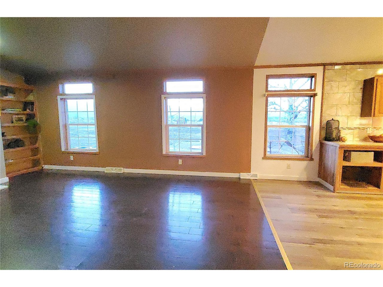 5339 County Road 19 Florence, CO 81226 - Photo 22 of 50 Family or Great room has wood burning fireplace and many windows looking out to the beautiful Wet mountain range.