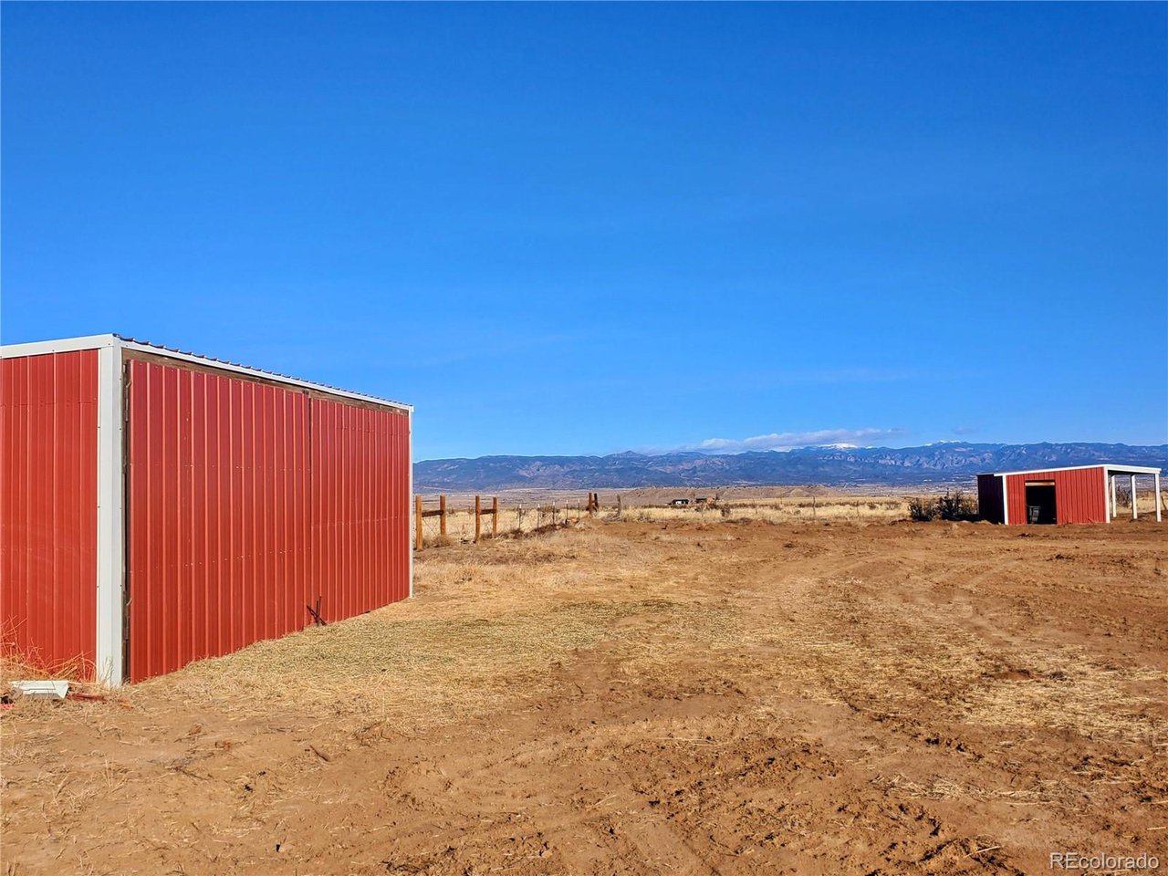 5339 County Road 19 Florence, CO 81226 - Photo 45 of 50 hay/feed storage barn on left, stable on Right