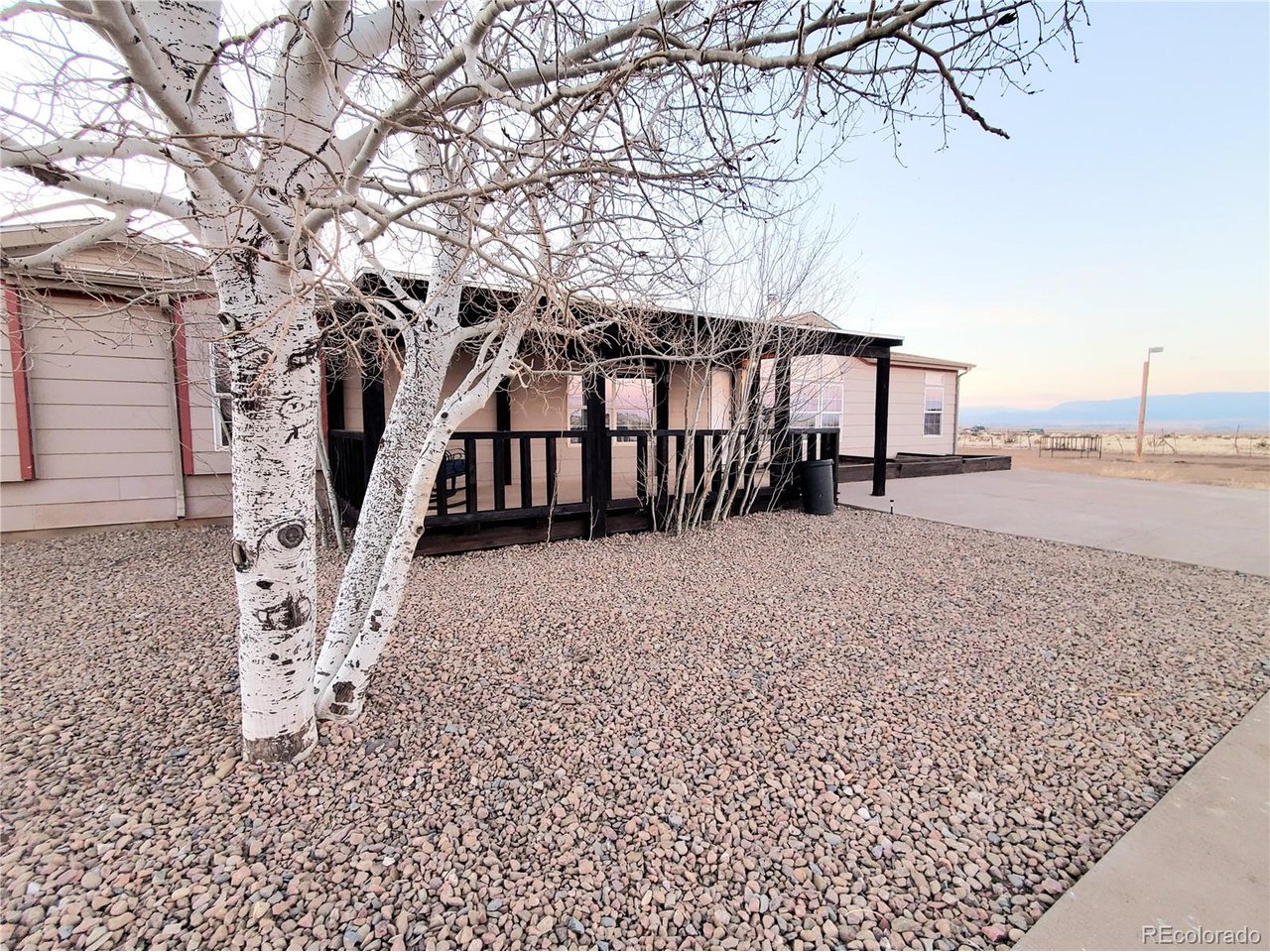 5339 County Road 19 Florence, CO 81226 - Photo 6 of 50 Mature aspens surround the spacious covered front porch