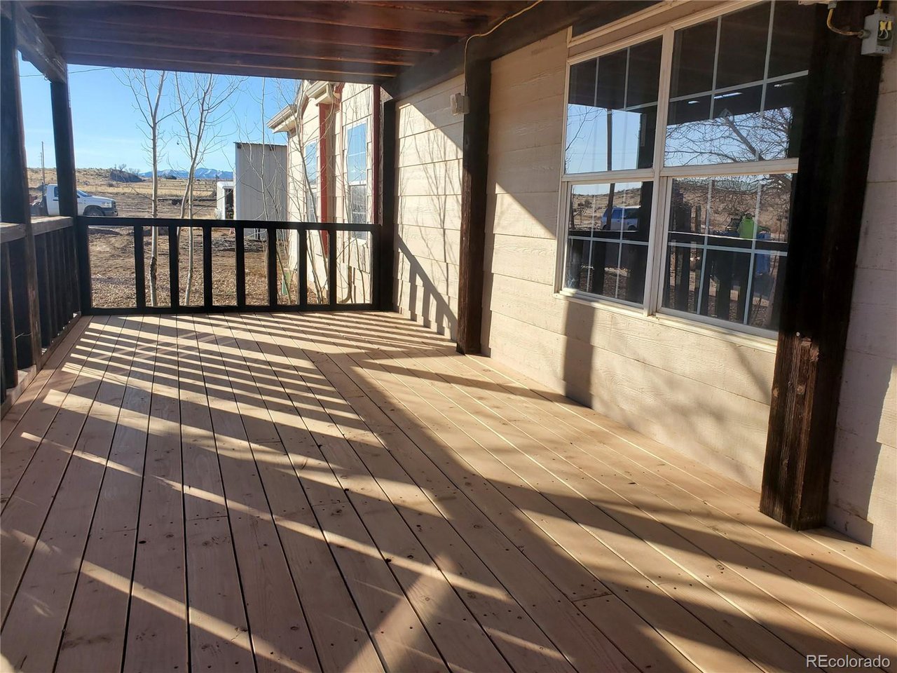 5339 County Road 19 Florence, CO 81226 - Photo 8 of 50 Spacious front porch new covered porch wood decking