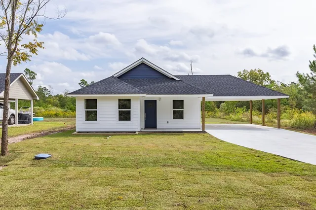 a front view of house with yard and porch