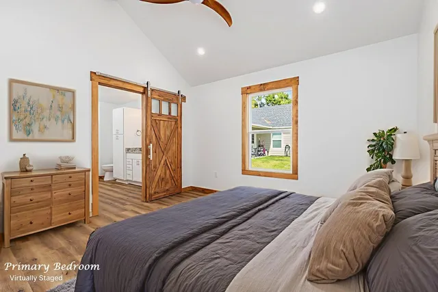 a bedroom with a bed and a closet